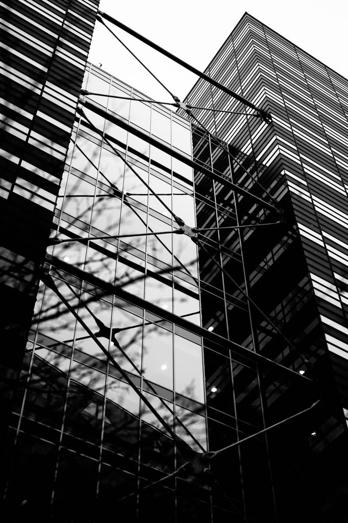 Stylish black and white photograph of a modern office building in Oslo, emphasizing urban architecture.